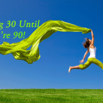 Beautiful young woman jumping on a green meadow with a colored tissue